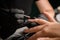 Close-up of process of coating nails with gel polish in the beauty salon.