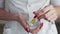 Close up of Professional beautician makes a white clay mask