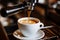 Close-up of a Professional Coffee Maker Brewing Rich Mocha Coffee into a White Cup