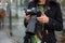 Close-up of professional female photographer on the street photographing on a camera.