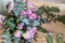 Close-up - professional florist creates a bouquet of eucalyptus and tulips. Work behind the counter of a flower shop