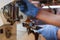 Close-up professional grinding freshly roasted coffee in espresso machine. Barista preparing coffee in a coffee shop