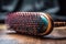 close-up of professional hairbrush, with visible bristles and streaks of color