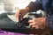 Close-up of a professional windshield repairman working with hydraulic polymer crack filler. Elimination of cracks and