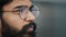 Close up profile face view portrait bearded thoughtful arabian boss entrepreneur business man in glasses indoor dreaming