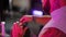 Close-up. Profile of a stylish male barber during a haircut in a modern hairdressing salon. A hairdresser cuts a