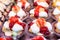 Close up of profiteroles, cream puffs or chou Ã  la crÃ¨me with whipped cream and strawberry jam, in displayed for sale