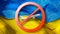 Close-up prohibition sign with crossed out white plane on the background of Ukrainian flag.