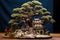 close-up of pruned bonsai tree with miniature landscape