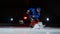 Close-up of the puck is on the ice and in slow motion hockey player pulls up and the snow flies into the camera and he