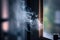 close-up of a puff of smoke escaping from the window, with blurred background