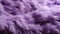 A close up of a purple fur background