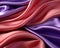 a close up of a purple and red satin fabric