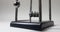 Close-up of of putting Newton\'s cradle in action over a white wall background. Infinite loop. Kinetic pendulum with