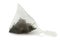 Close-up pyramid tea bag with black earl gray tea isolated on white background