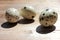 Close-up of quail eggs on wooden background. Natural hard light.