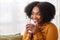 Close-up of a radiant African American woman with a captivating smile