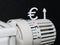 close up of a radiator thermostat with a euro sign and an up arrow symbolize rising heating costs