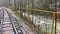 Close up of railway in mountainous terrain. Railway track in rainy weather in amazing and mysterious nature.