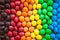 Close up of rainbow colored candy, sugar coated candies. Candy delicious sweets background. Colorfull candies