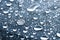 Close-up of raindrops of different sizes on the surface covered with cling film. Moisture weather and humidity concept