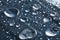 Close-up of raindrops of different sizes on the surface covered with cling film. Moisture weather and humidity concept