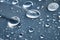 Close-up of raindrops of different sizes on the surface covered with cling film. Moisture weather and humidity concept