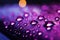 Close up Raindrops on window with soothing purple light illuminating them