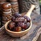 Close up Ramadan concept Wooden spoon with Medjool dates, highly nutritious