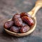 Close up Ramadan concept Wooden spoon with Medjool dates, highly nutritious