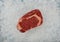 Close up raw beef ribeye steak on crushed ice