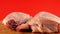 Close-up of raw chicken meat rotates on a wooden surface. Raw chicken legs. Cooking poultry. Selective focus, shallow depth of fie