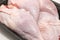 Close-up of raw chilled chicken legs on a substrate