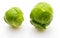 Close-up of raw, fresh and whole brussels sprouts cabbages - Brassica oleracea. Isolated on white background