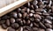Close up of real coffee beans on wooden background