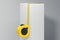 Close up of realistic yellow measure ruler on white cube. 3d rendering,