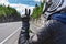 Close-up rear view of motorcyclist showing victory sign with hand in leather glove