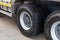 A close-up of the rear wheels of a truck with new Bridgestone L355 tires. Tubeless tires on a clean truck. Trucking