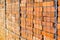 Close up of reclaimed bricks stacked in a metal cage