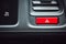 Close up of rectangle shape red color car emergency button on the dashboard in luxury car