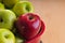 Close-up of a red apple amidst green ones