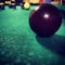 Close up of a red ball at a billards game