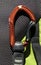 Close up of a red carabiner. Rock climbing gear concept