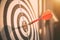 Close up red color arrow in the center of Bullseye or bull`s-eye for business targeting