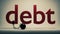 Close up of red debt text