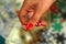 Close up of red dice in woman`s hand on the blurred background
