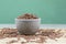 Close-up of red integral rice with selective focus on the wooden table