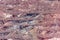 Close-up of red mining levels at iron ore quarry. Open-cast mine, open pit. Background, texture