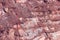 Close-up of red mining levels at iron ore quarry. Open-cast mine, open pit. Background, texture