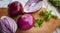 Close-up of red onions with fresh cilantro on cutting board